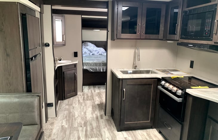 View from the living room, through the bathroom, and into the master suite