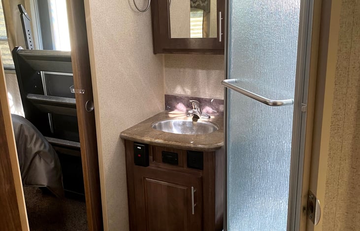 Bathroom with entrances to bedroom and 
main living area