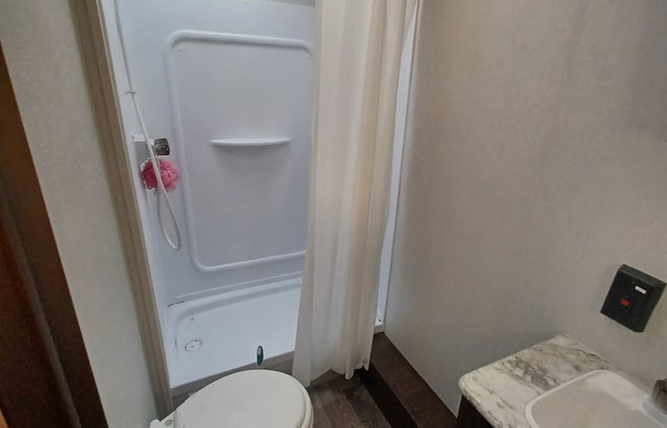 Bathroom located next to bunk beds.