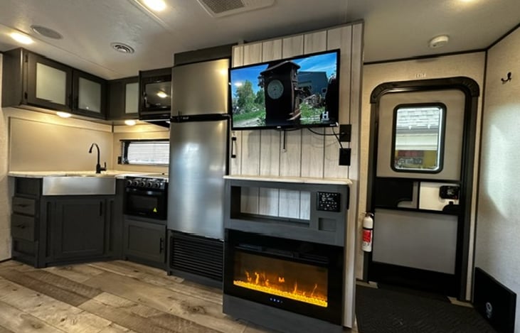 Fridge, pantry, all cooking utensils, electric fireplace, storage, and much more.