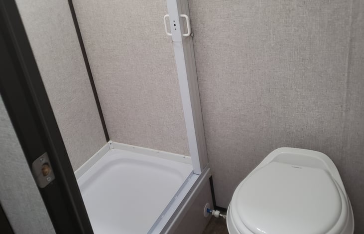Inside shower and foot flush toilet