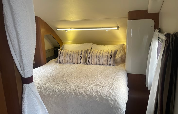 Walk around queen sized bed! Linens and pillows provided!