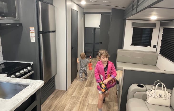 Looking from entry door, in front of bedroom. Back is bunk room. Door on left is bathroom.