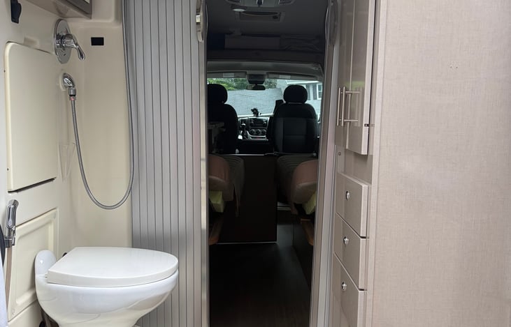 Wet bath:
Toilet, fold out sink, mirror with medicine cabinet, wrap around shower curtain
Closet with drawers, privacy curtains for the back door.