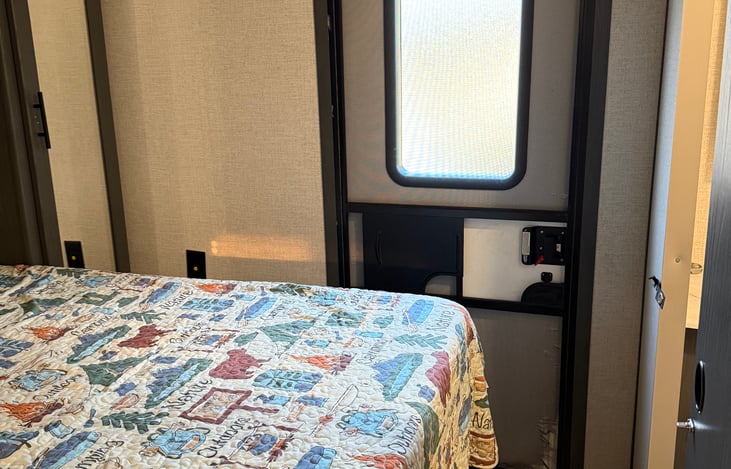 Private master bedroom has a door to the outside.