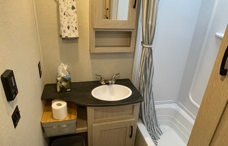 Comfortable bathroom with sink,closet, hot/cold water.