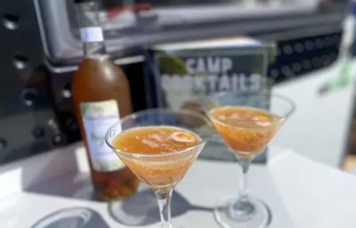 Cocktail height table setup on the outside front of Sun-Chaser makes relaxation and socializing an enjoyable and easy event.