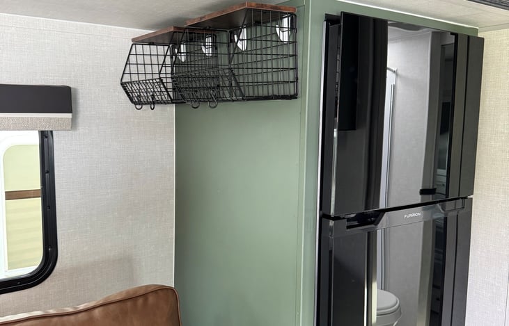 Large fridge and extra storage.