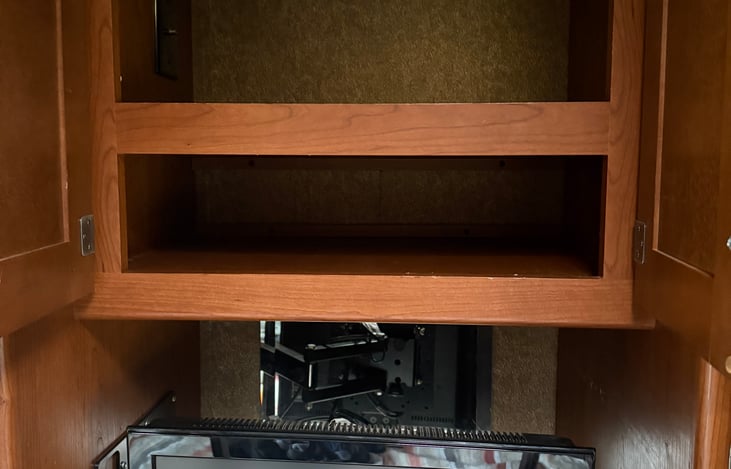 Master bedroom above TV extra storage