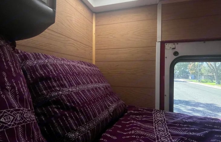 Maxxair fan with rain guard and remote above bed