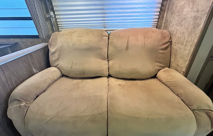 Large, dual recliners have replaced the small sofa