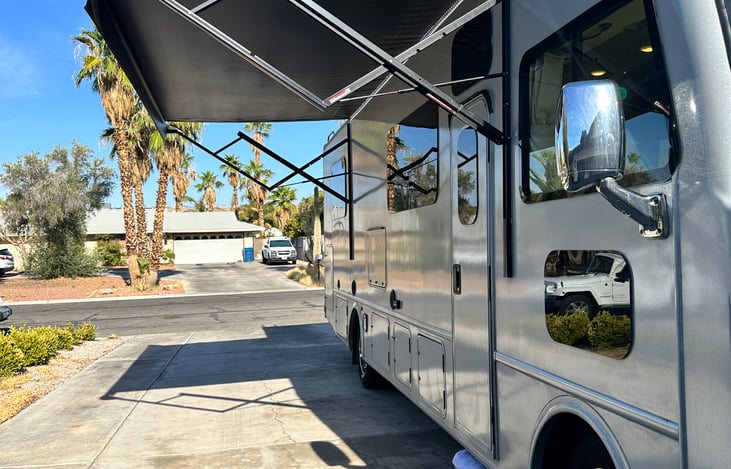 Brand new awning for outside hangs plus an outdoor TV