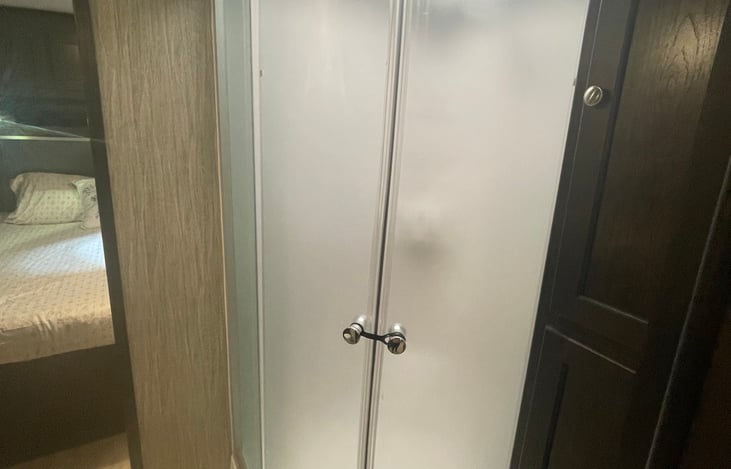 Main bathroom with skylight above shower.