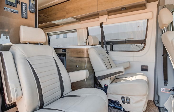 Rear captain's chairs behind the driver and passenger area.