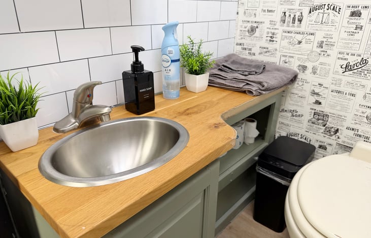 Private RV bathroom with toilet, sink & easy-clean interior – everything you need on the road