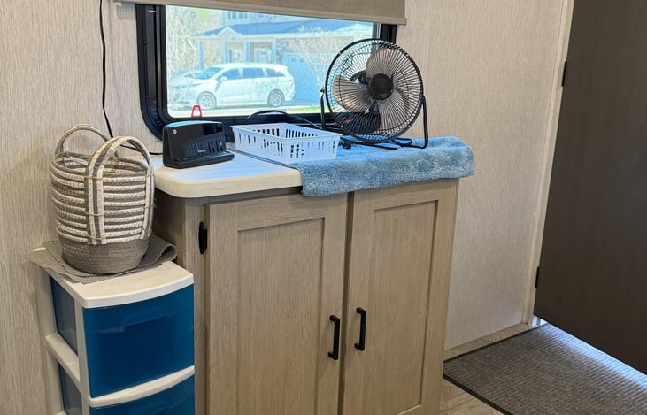 Small fan and alarm clock (just in case).  Stored in the bedroom cabinet.