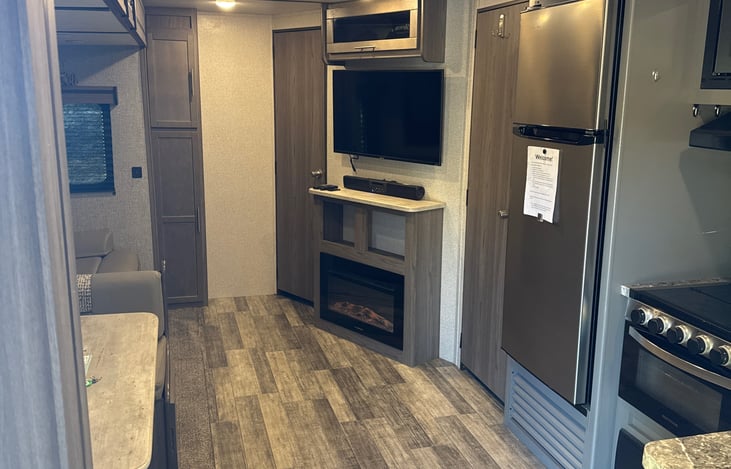 Living/Kitchen area with electric fireplace