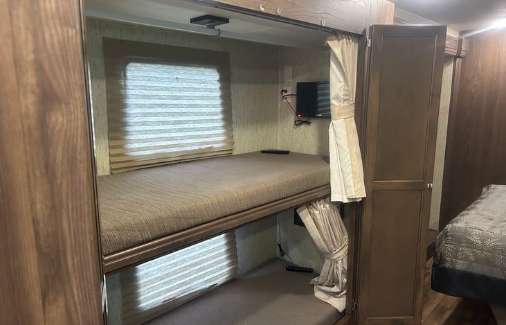Twin Bunks with private televisions.