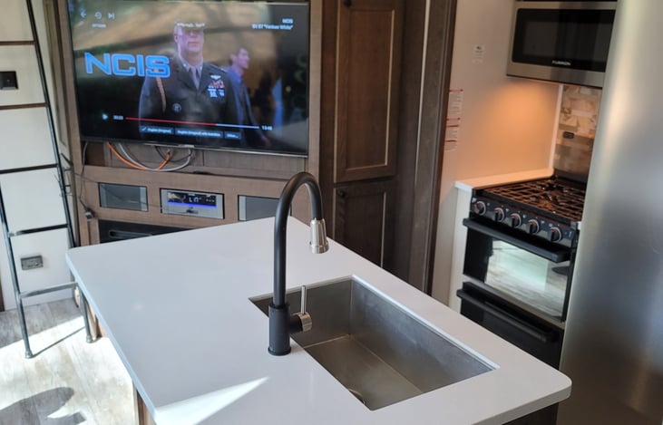 Island kitchen providing quite a lot of preparation area!