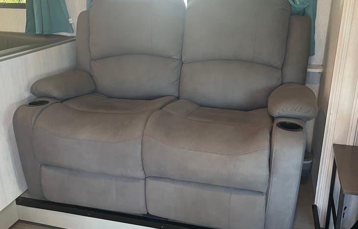 An upgraded sofa for two that fully reclines.