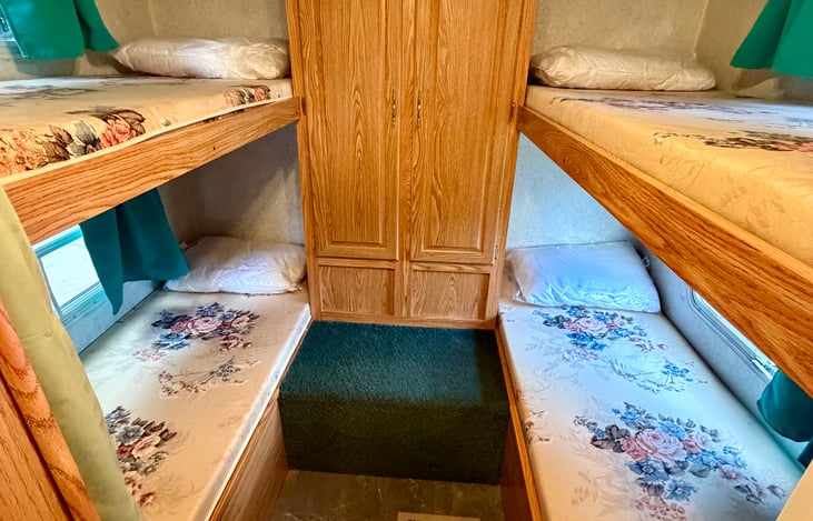 4 twin bunks in back room. 30” x 75” long beds