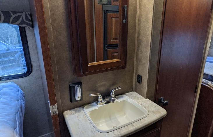 Sink between master and bathroom is accessible even if someone is using the shower.  Very convenient.