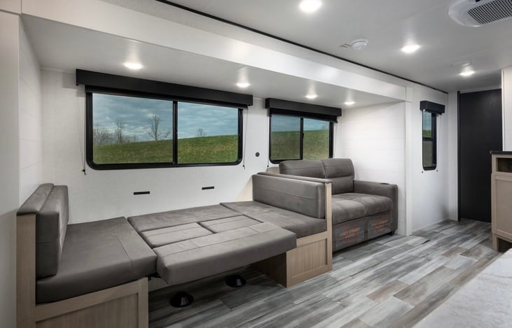 JayBird, Close up of Dinette down for bed lots of ambient light from big windows and comfortable chairs.