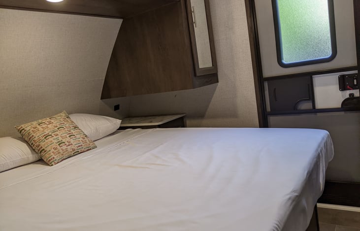 Bedroom with plenty of space, cabinets, & windows on both sides (not shown), The external door (not shown) on the right side.