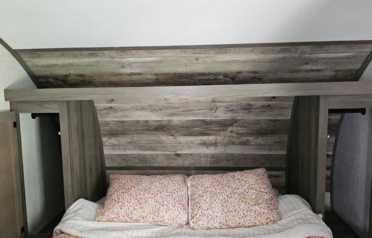 Shelf above bed where you place more items for your stay