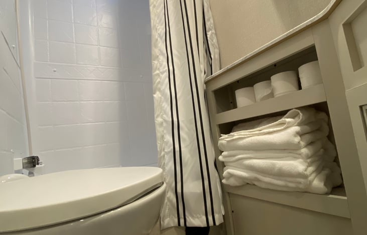 Restroom + shower view with sky lighting