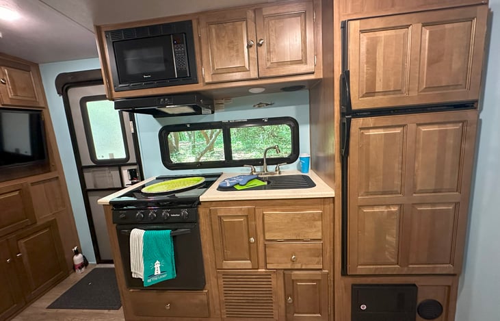 Great Kitchen with gas stove, over, microwave, freezer and refrigerator. It's amazing how much storage you have!