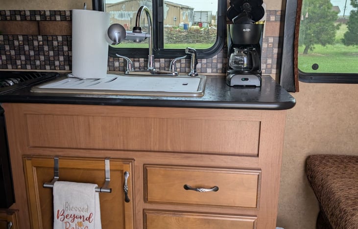 Kitchen comes supplied with coffee maker, dinnerware, pots, pans, cutting boards, cooking utensils and more!