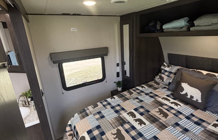 Cozy front bedroom with queen size bed, plenty of storage, your own entrance and an escape window.