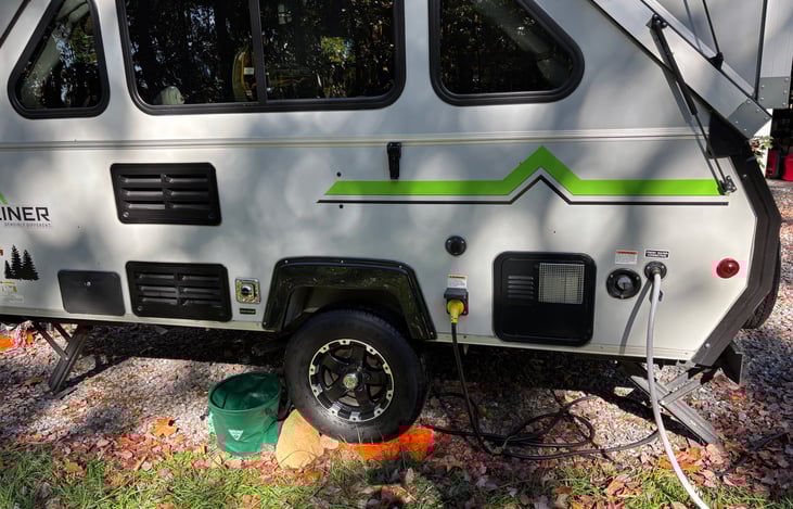 City water and electric hookups, water tank, cable input and outdoor hot/cold shower