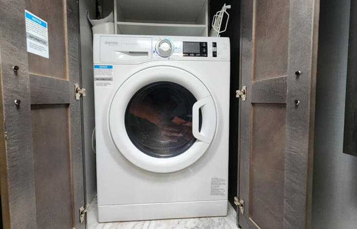 Washer/Dryer combo inside Master bath.