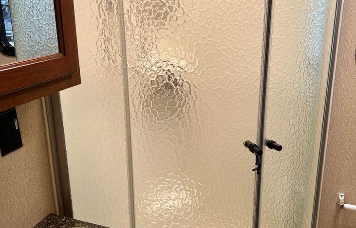 Nice size shower with on/off switch on the shower head.