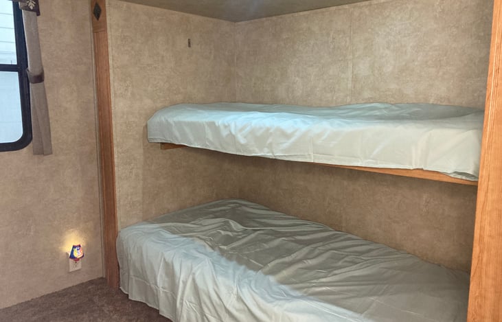 Two of the 3 bunks in the back bedroom