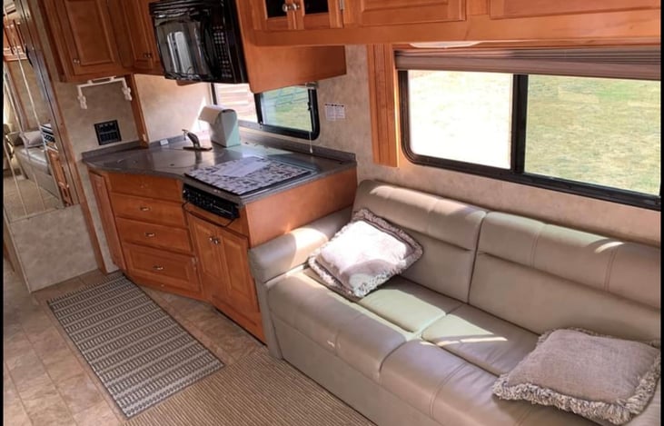 Living room slide. Couch opens to sleep 1.