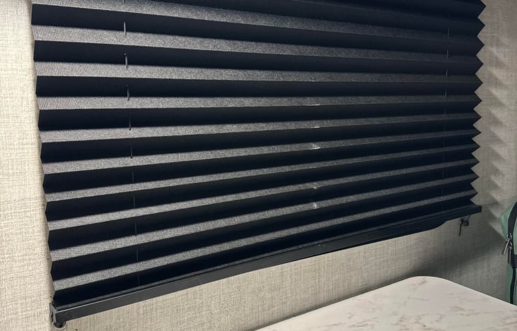 Black out curtains on windows (Helpful when you are parked at a bright campsite)