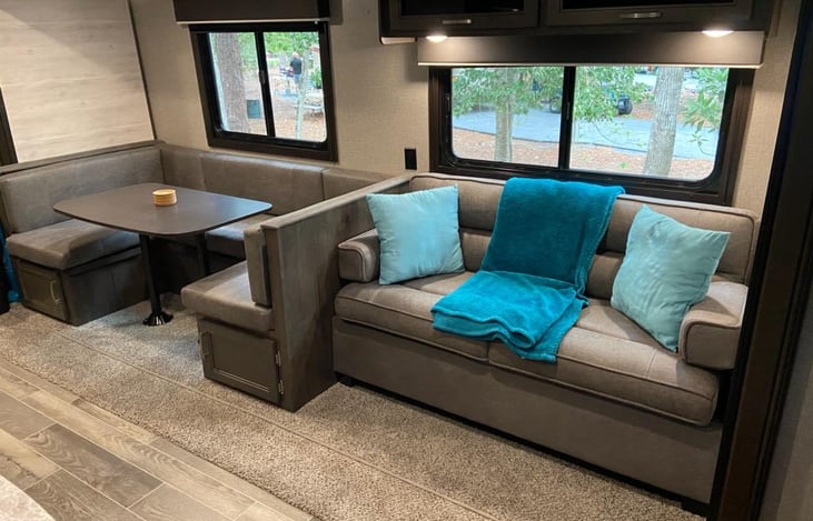 Couch converts to a sleeping area.