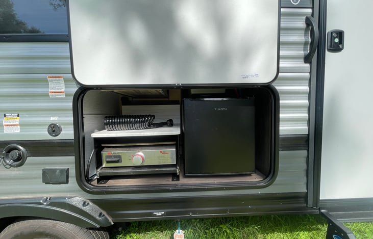 Equipped with outdoor kitchen. Grill top and mini fridge