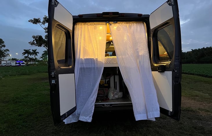 You can keep the back door open and the curtains will provide privacy.