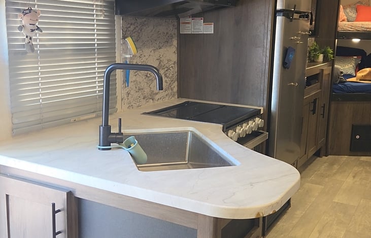 Gas stove, Stainless steel sink, Microwave, Refrigerator