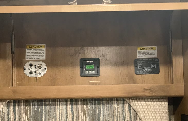 Control area above entrance door for loft bed.