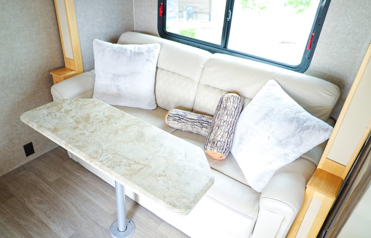 Comfy couch with table.  Can also pull out to a queen bed