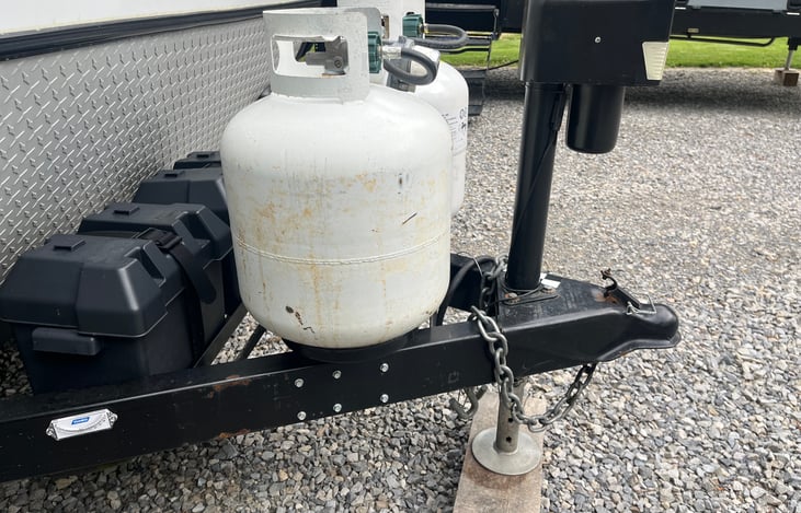 Two propane tanks and two batteries.
