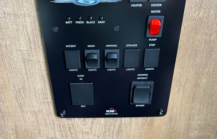 Controls for various options, indoor & outdoor lighting, LED running lights, step light,pass through lights, optional blue retro lighting (indoors and outdoors.) Also controls huge spacious awning!