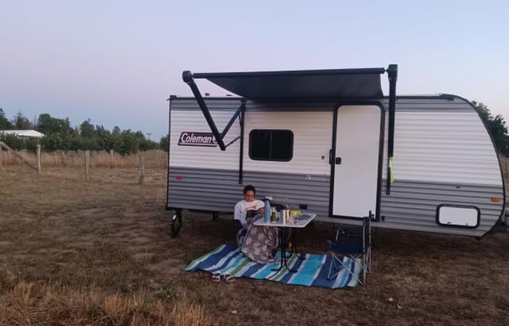 The outside of Calliope in her natural element. Books and rugs makes everything better.