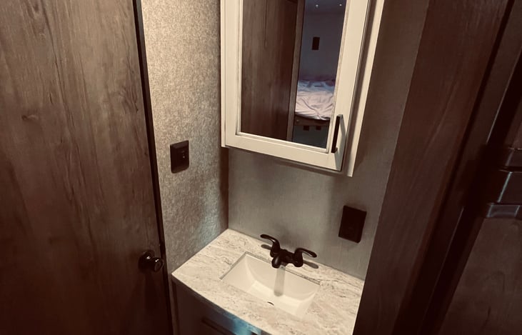 Sink vanity separate from bathroom