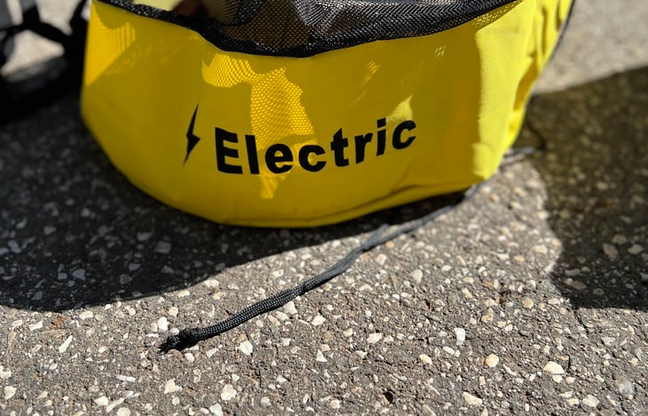 Electric bag; with extension cords, Surge Protector, and additional electrical appliances.